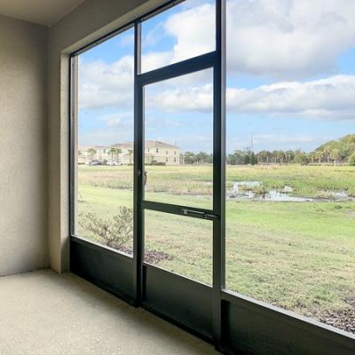 Screened back patio with conservation views