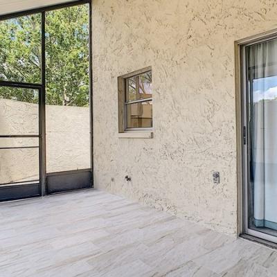 Screened patio with tile flooring