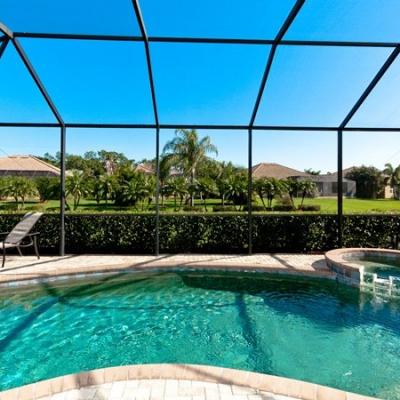 Covered lanai with heated pool and spa
